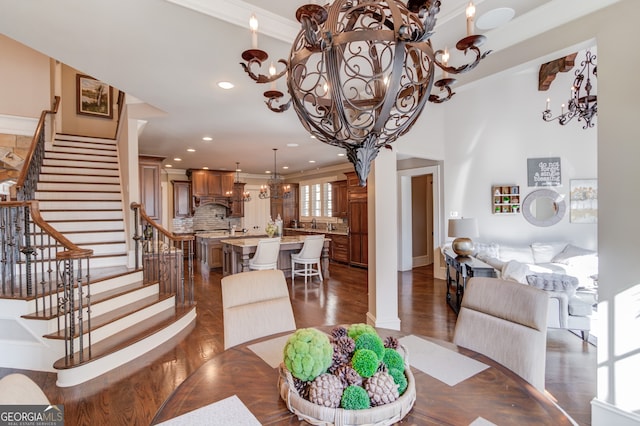 dining area featuring crown molding and a notable chandelier