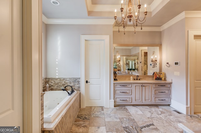 bathroom featuring a raised ceiling, a notable chandelier, tiled tub, vanity, and ornamental molding