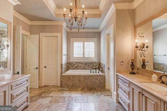 bathroom with a chandelier, vanity, a relaxing tiled tub, and ornamental molding