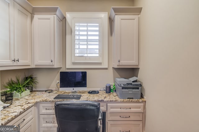 office area featuring built in desk