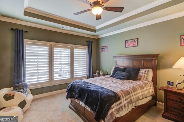 bedroom with light carpet, a raised ceiling, ceiling fan, and crown molding