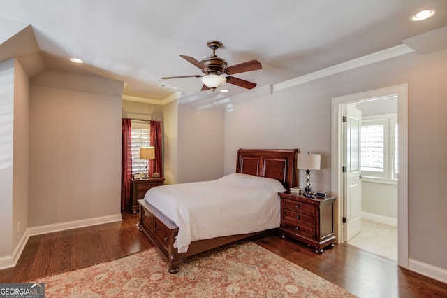 bedroom featuring ceiling fan, crown molding, and dark hardwood / wood-style floors