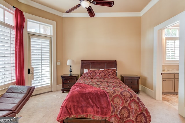 carpeted bedroom with multiple windows, connected bathroom, and ceiling fan