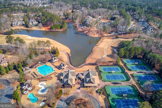 birds eye view of property with a water view