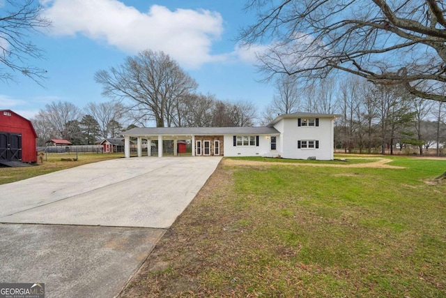 tri-level home with a front yard and a carport