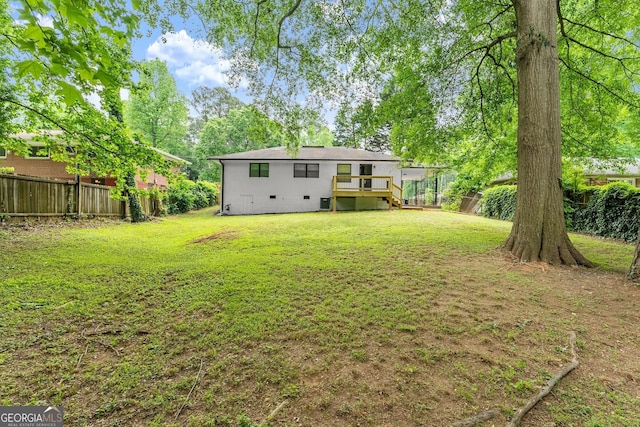 rear view of property with a lawn