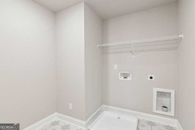 clothes washing area featuring hookup for an electric dryer, laundry area, washer hookup, baseboards, and tile patterned floors