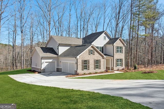 view of front facade featuring brick siding, roof with shingles, a front yard, a garage, and driveway