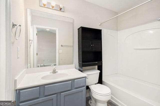 full bathroom featuring shower / washtub combination, vanity, and toilet