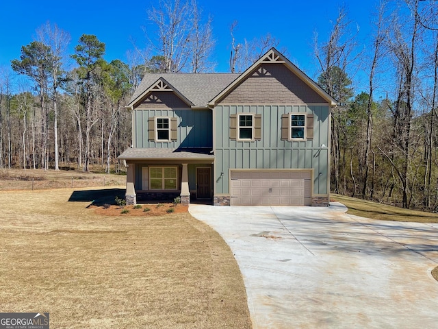 craftsman inspired home featuring stone siding, board and batten siding, an attached garage, and driveway