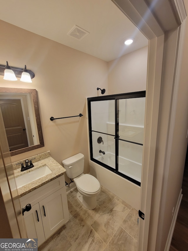 15 Dixon Rd, Newnan, GA 30263 - full bath with visible vents, bath / shower combo with glass door, toilet, and vanity