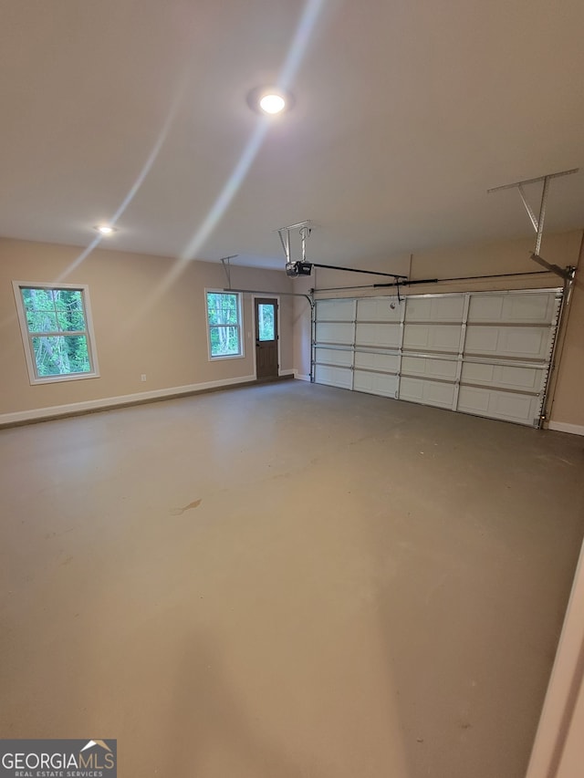 15 Dixon Rd, Newnan, GA 30263 - garage with baseboards and a garage door opener