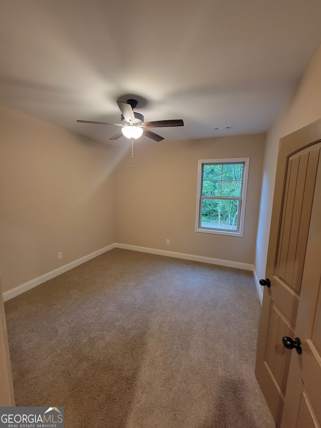 15 Dixon Rd, Newnan, GA 30263 - carpeted spare room featuring baseboards, a ceiling fan, and visible vents