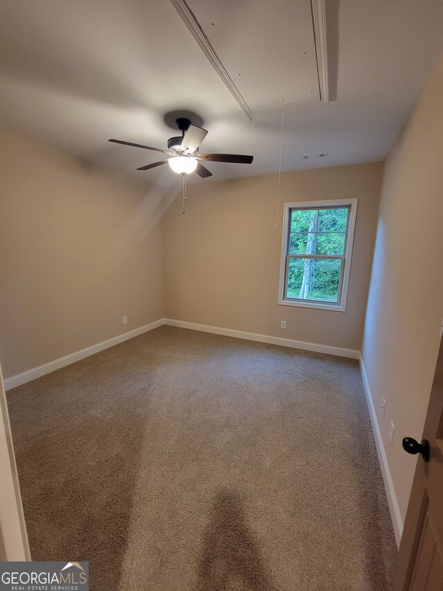 15 Dixon Rd, Newnan, GA 30263 - carpeted spare room with baseboards, ceiling fan, and attic access