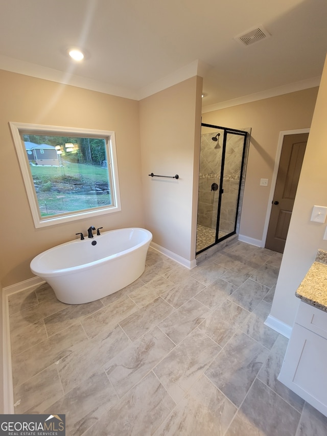 15 Dixon Rd, Newnan, GA 30263 - bathroom featuring crown molding, baseboards, a shower stall, visible vents, and a soaking tub