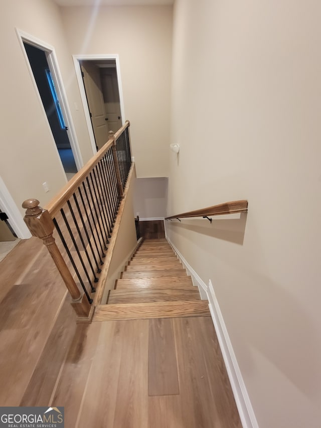 15 Dixon Rd, Newnan, GA 30263 - stairway with baseboards and wood finished floors