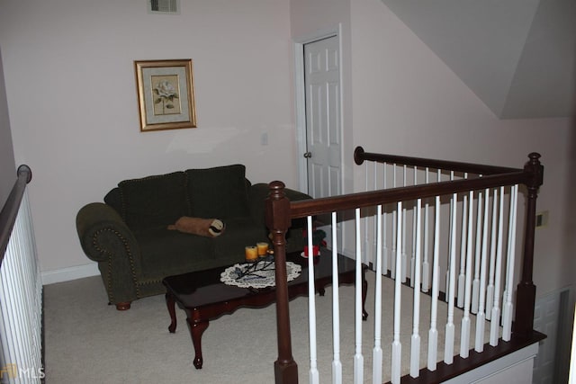 living room with carpet flooring and vaulted ceiling