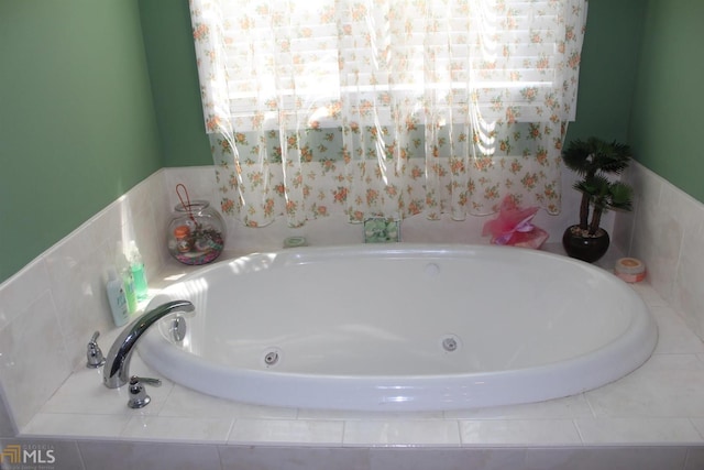 bathroom with tiled bath