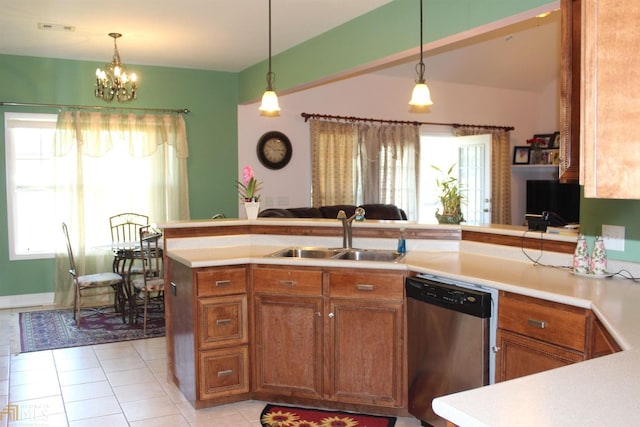 kitchen with dishwasher, pendant lighting, kitchen peninsula, and sink