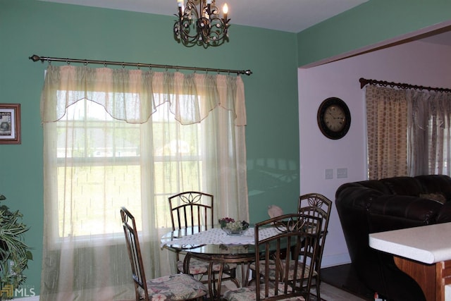 dining space with an inviting chandelier