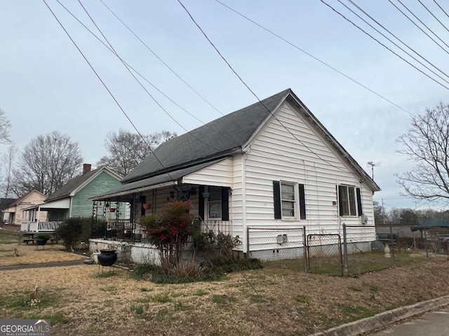 view of property exterior featuring covered porch