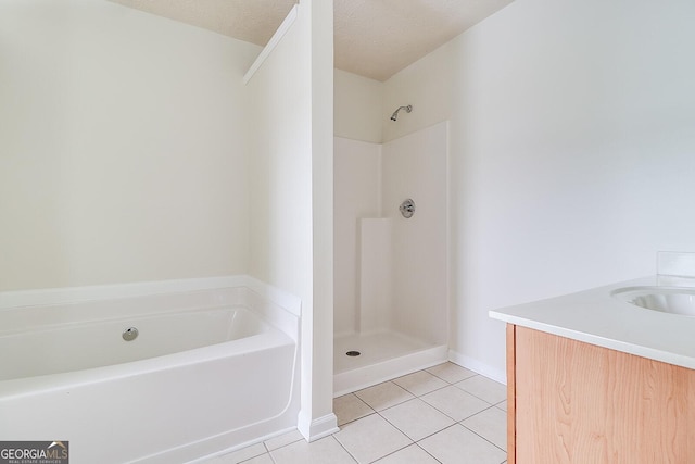 bathroom with vanity, tile patterned flooring, and a textured ceiling