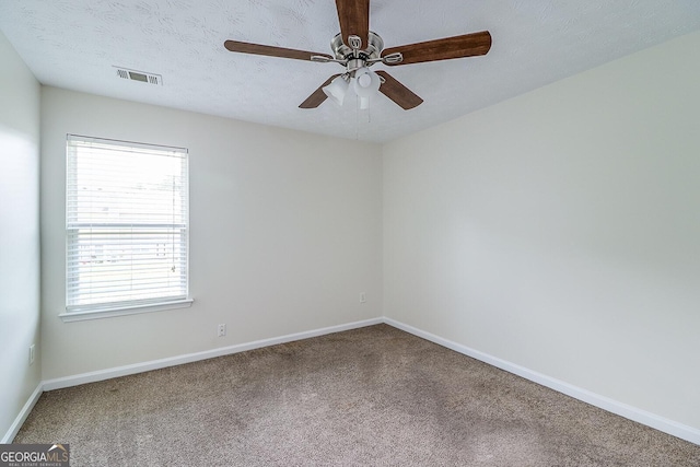 unfurnished room featuring carpet flooring, a textured ceiling, and ceiling fan