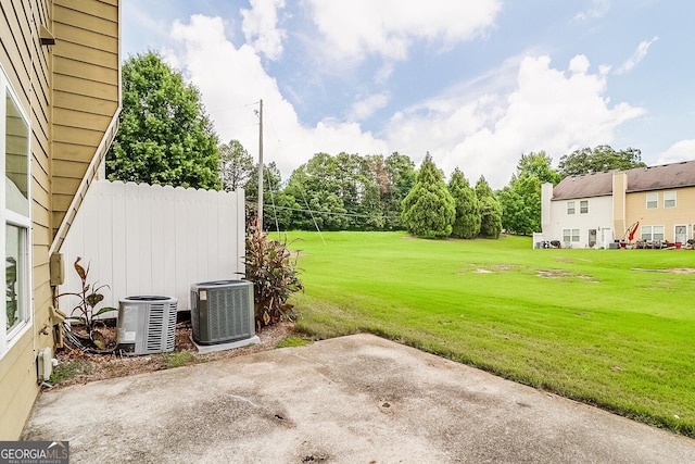 view of yard featuring cooling unit and a patio area