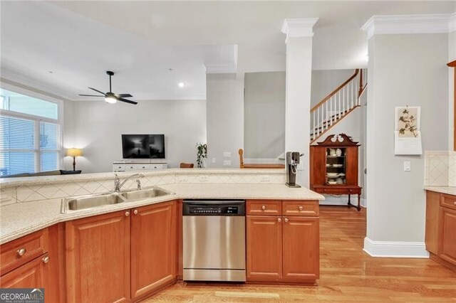 kitchen with dishwasher, light hardwood / wood-style floors, ornamental molding, and sink