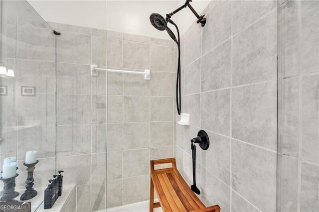 bathroom with a tile shower