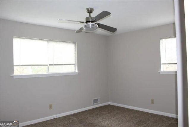 empty room featuring ceiling fan and carpet floors