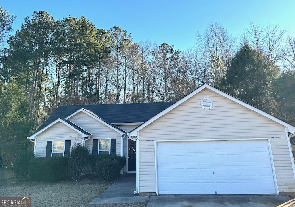 single story home with a garage