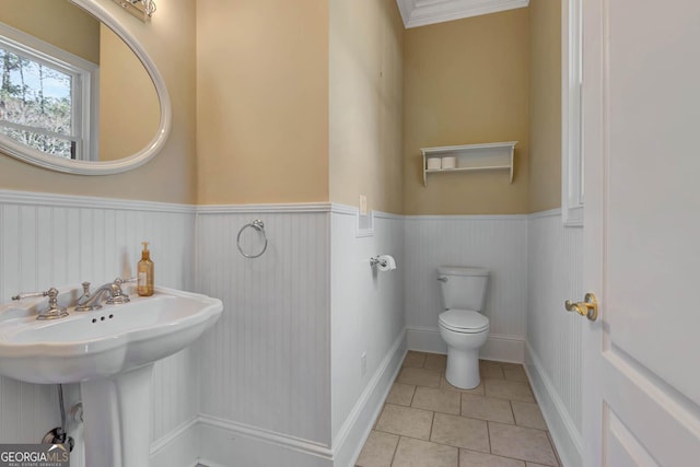 bathroom featuring tile patterned floors, toilet, and sink