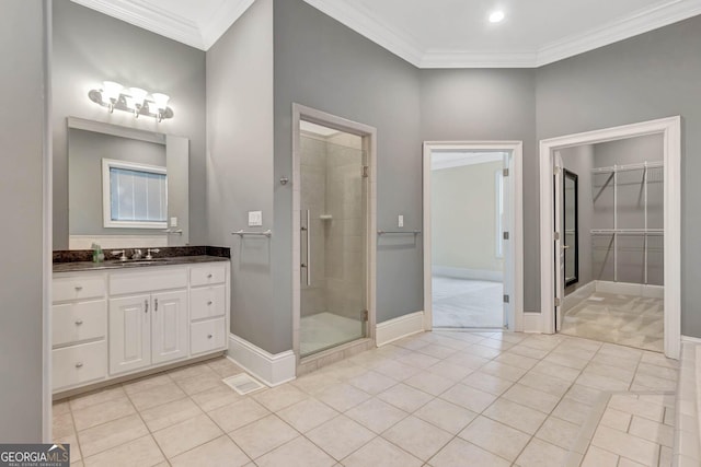 bathroom featuring tile patterned flooring, vanity, an enclosed shower, and crown molding