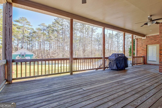 exterior space with a grill and ceiling fan