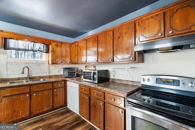 kitchen with dark hardwood / wood-style flooring, sink, and appliances with stainless steel finishes