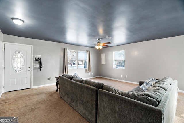 carpeted living room featuring ceiling fan