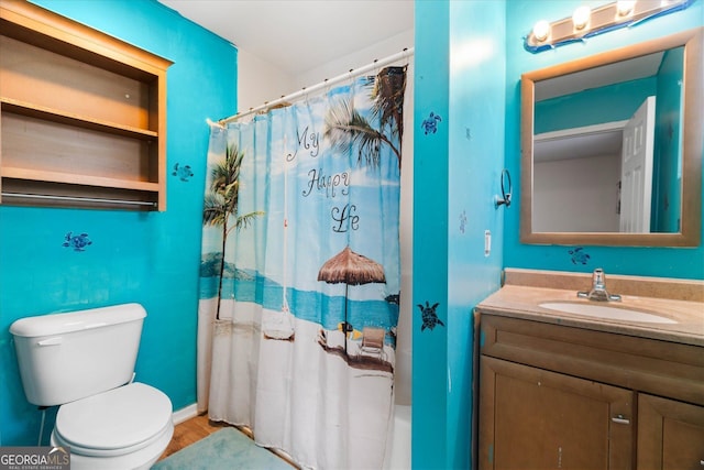 bathroom with wood-type flooring, vanity, toilet, and curtained shower