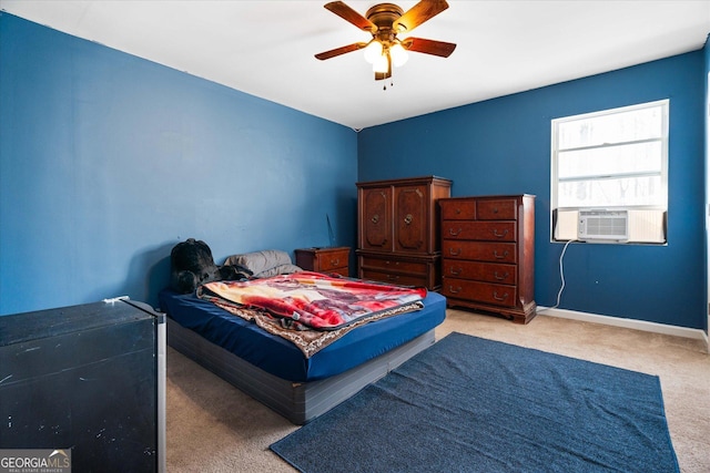 bedroom with ceiling fan, cooling unit, and light carpet