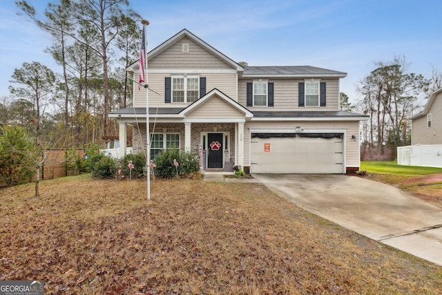 view of front facade featuring covered porch and a garage