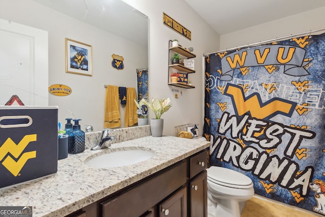 bathroom with vanity and toilet