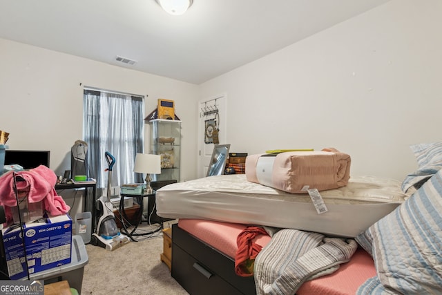 bedroom with light colored carpet