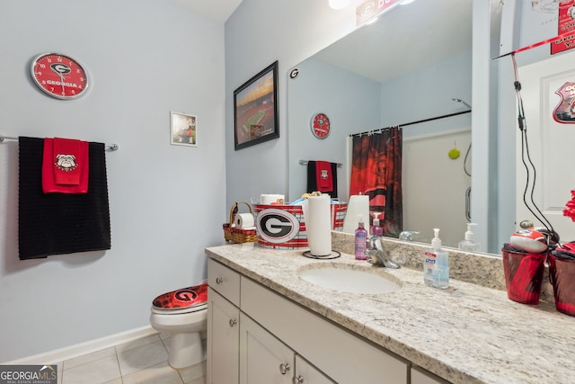 bathroom featuring tile patterned flooring, vanity, curtained shower, and toilet