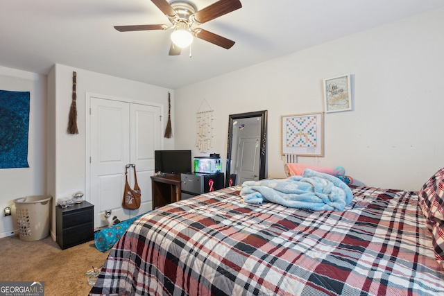 carpeted bedroom with a closet and ceiling fan