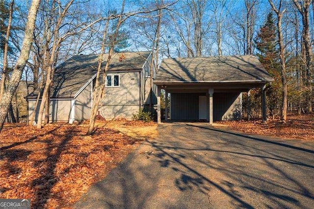 view of property exterior featuring a carport