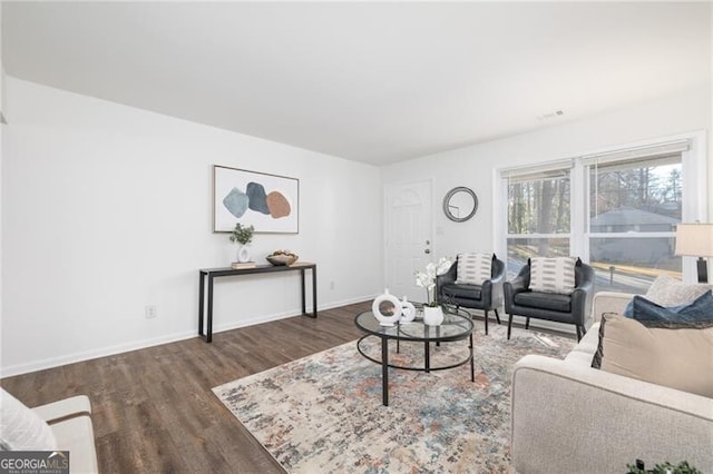 living room with dark hardwood / wood-style flooring