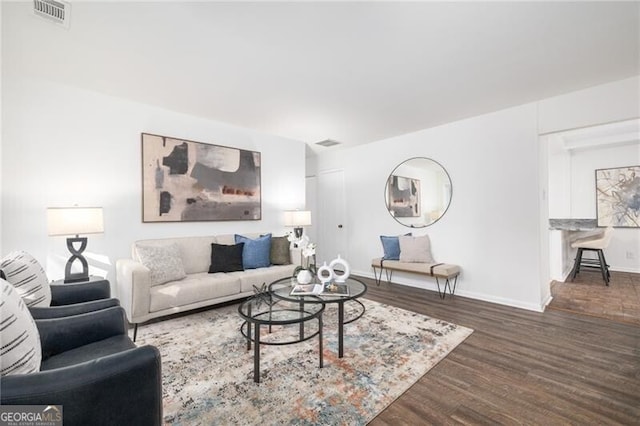 living room featuring dark hardwood / wood-style floors