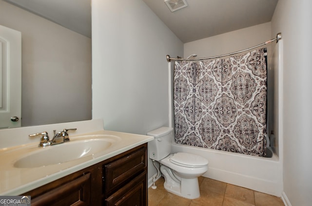 full bathroom featuring tile patterned floors, vanity, shower / bath combination with curtain, and toilet