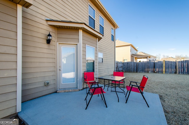 view of patio / terrace featuring outdoor dining area and fence