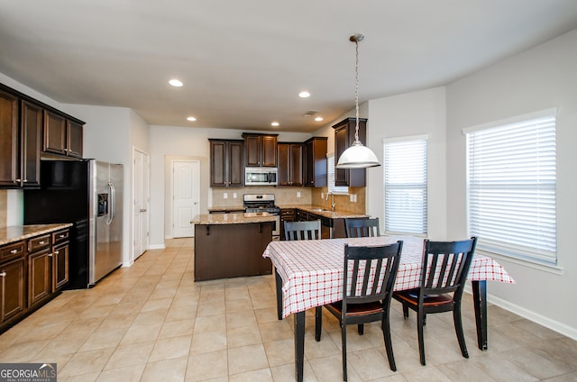 tiled dining space with sink